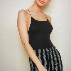 Black Halter-Style Bodysuit with Black Leather and Black Tie Pants with Black